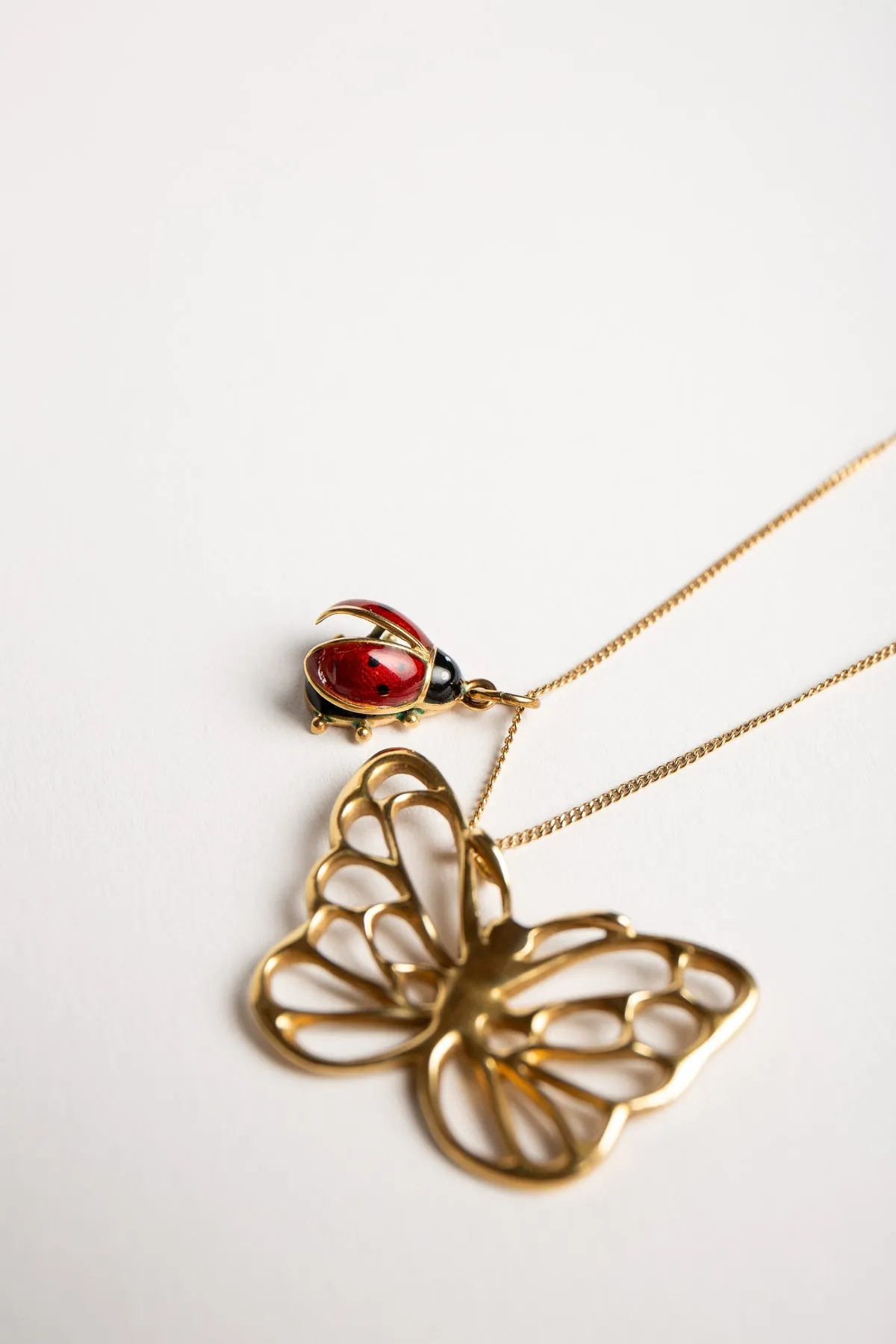 ANGELA CUMMINGS FOR TIFFANY & CO. | VINTAGE GOLD BUTTERFLY PENDANT WITH LADYBUG CHARM & CHAIN