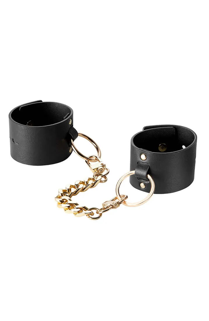 Wide faux leather cuffs with chain